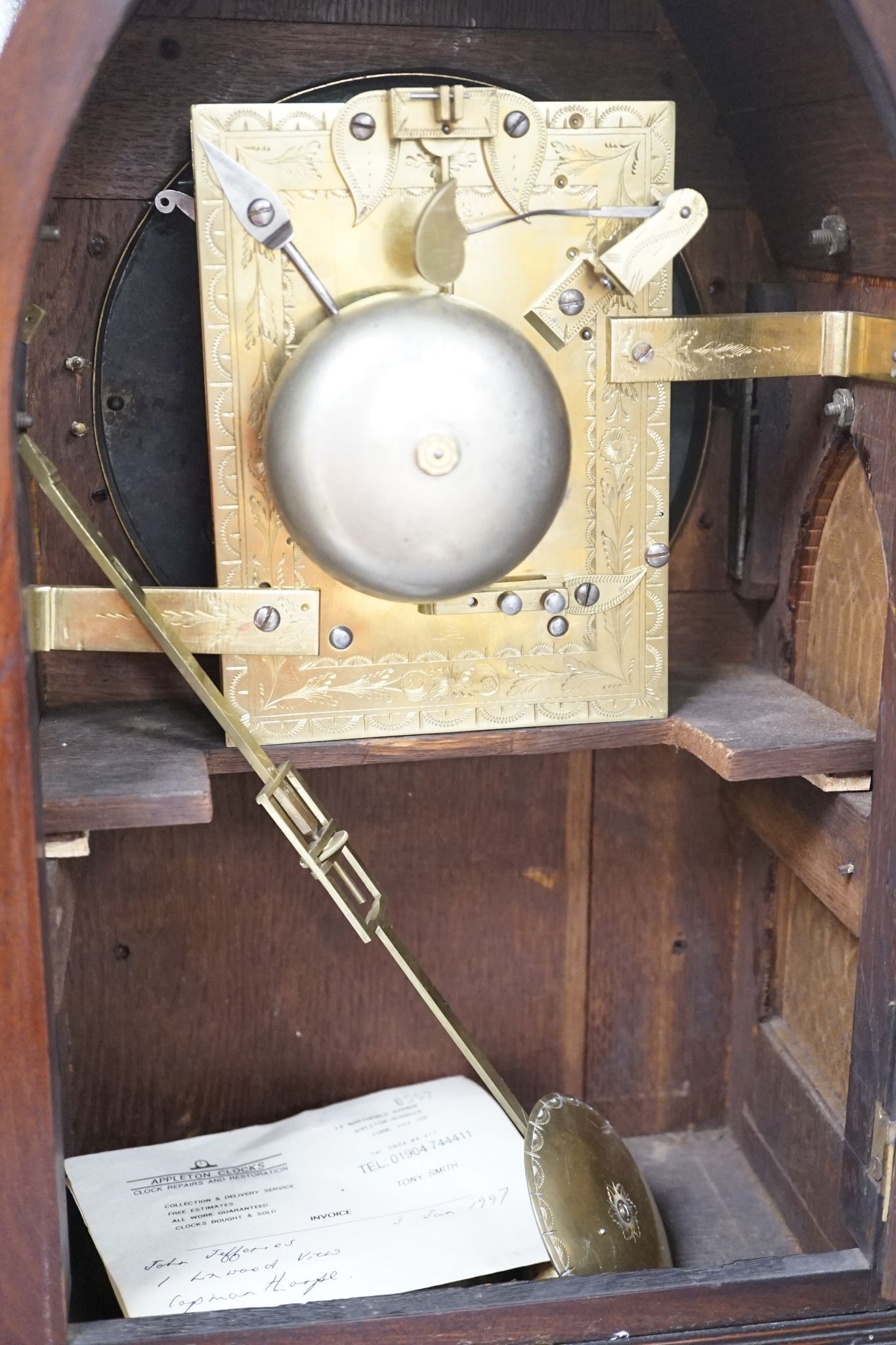 An early 19th century lancet shape mahogany mantel clock, 49cm